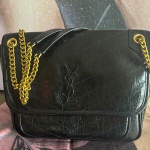 Saint Laurent Black Quilted Leather Shoulder Bag with Gold Chain.